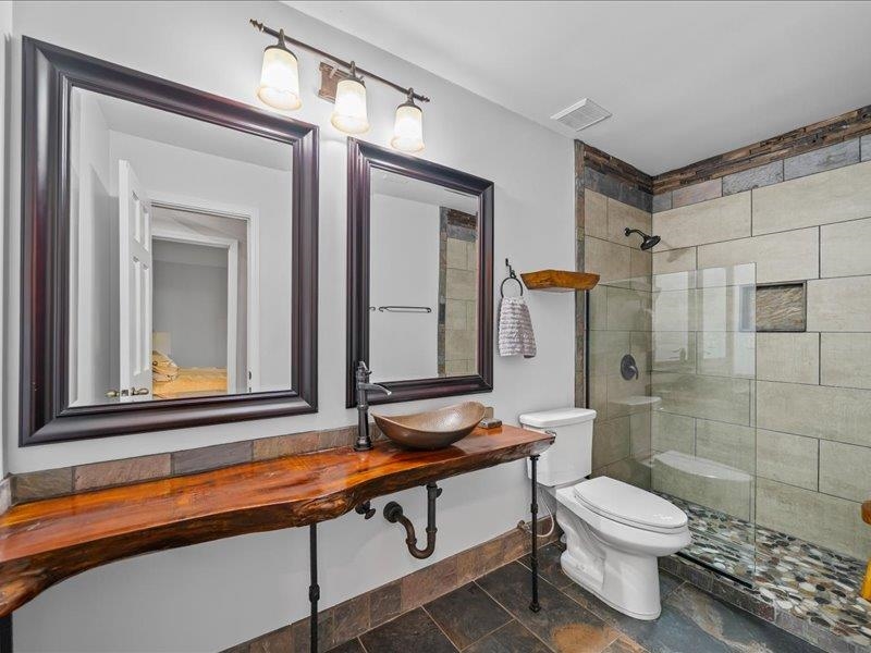 8104 Jack Bond Road Arlington, TN 38002 - Photo 19 of 40 a bathroom with a sink a toilet and shower