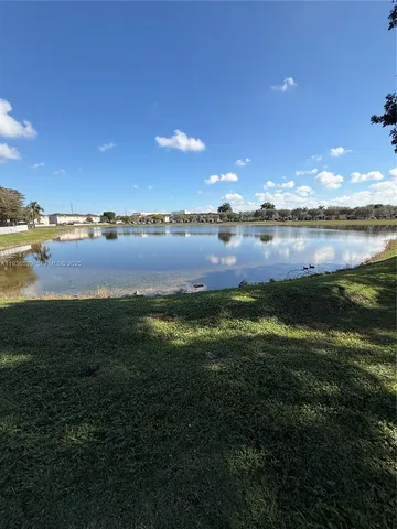 a view of a lake from a yard