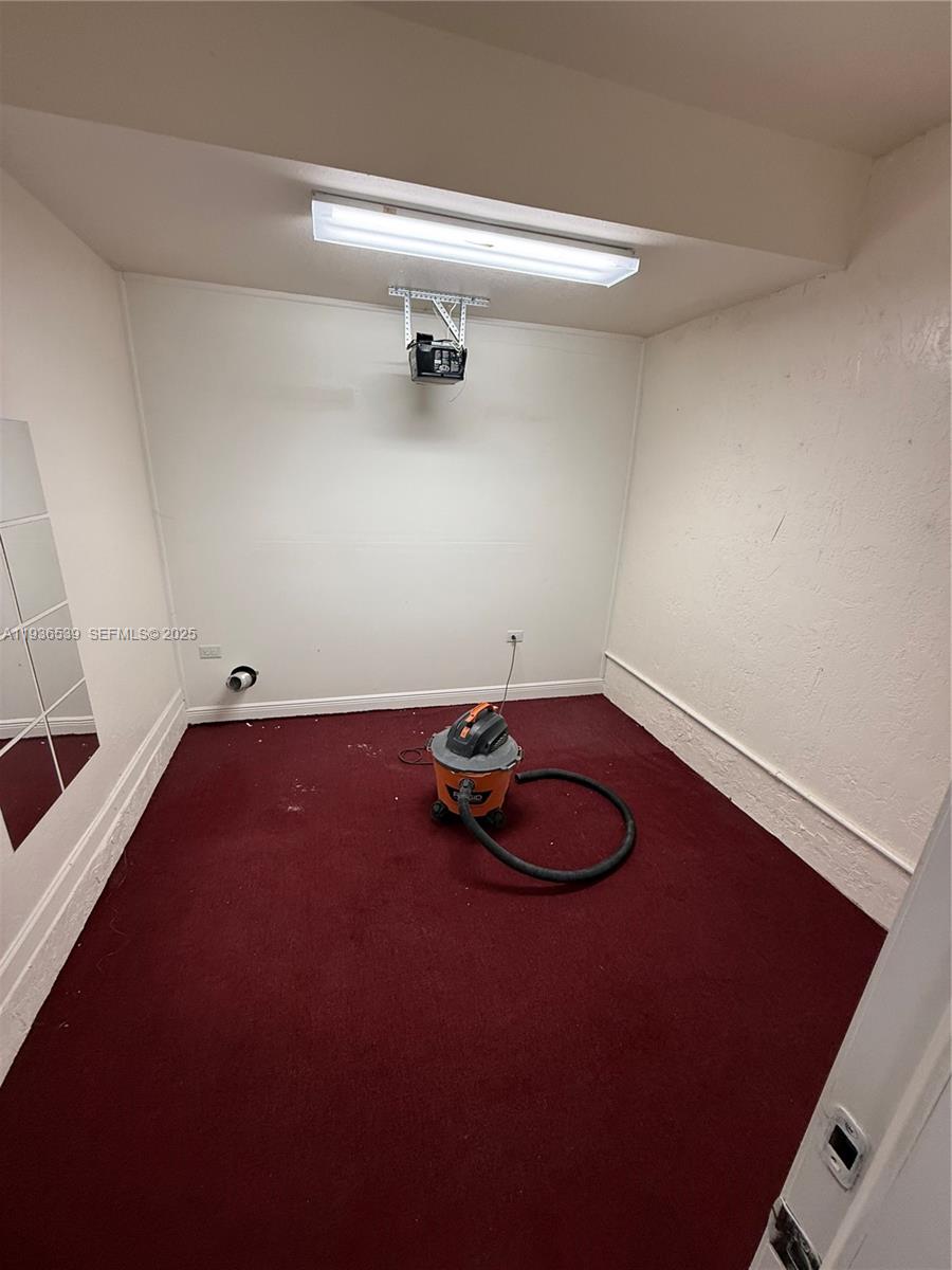 904 Southwest 154th Path Miami, FL 33194 - Photo 7 of 18 a view of a room with racks on the wall