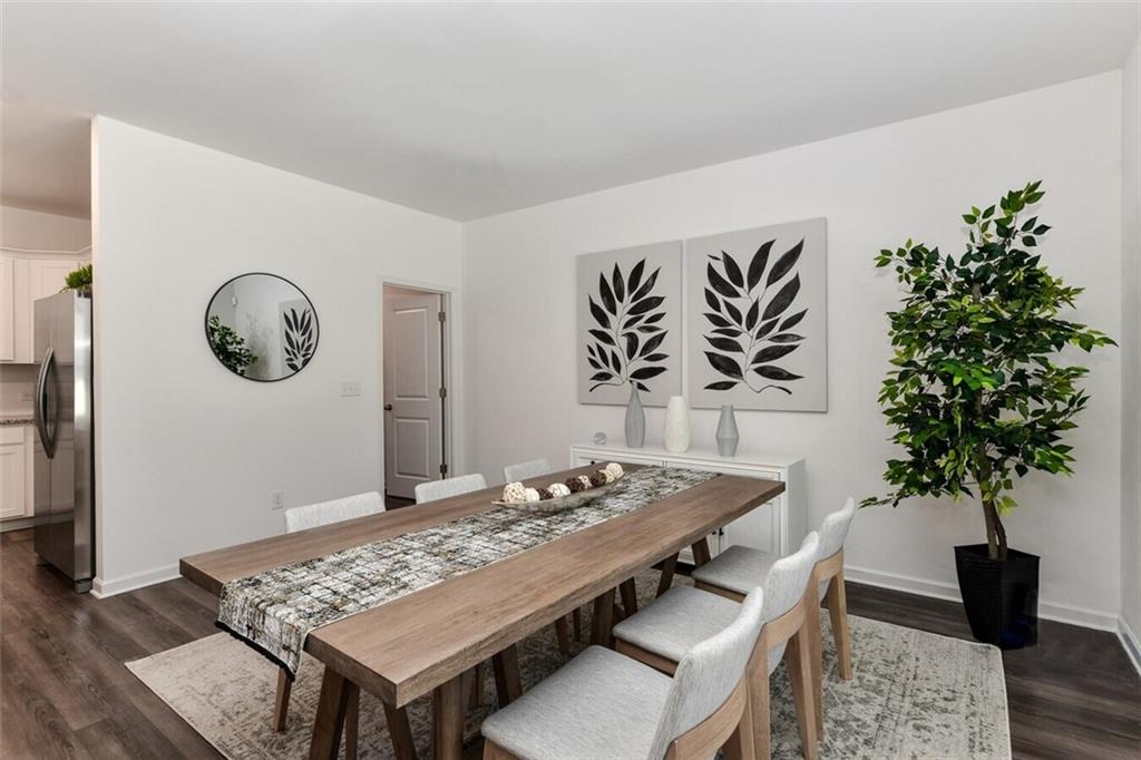 12006 Crosswicks Road, Unit SUNSHINE Union City, GA 30291 - Photo 4 of 20 a view of a dining room with furniture and wooden floor