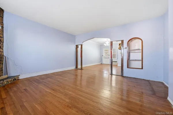 a view of a room with wooden floor