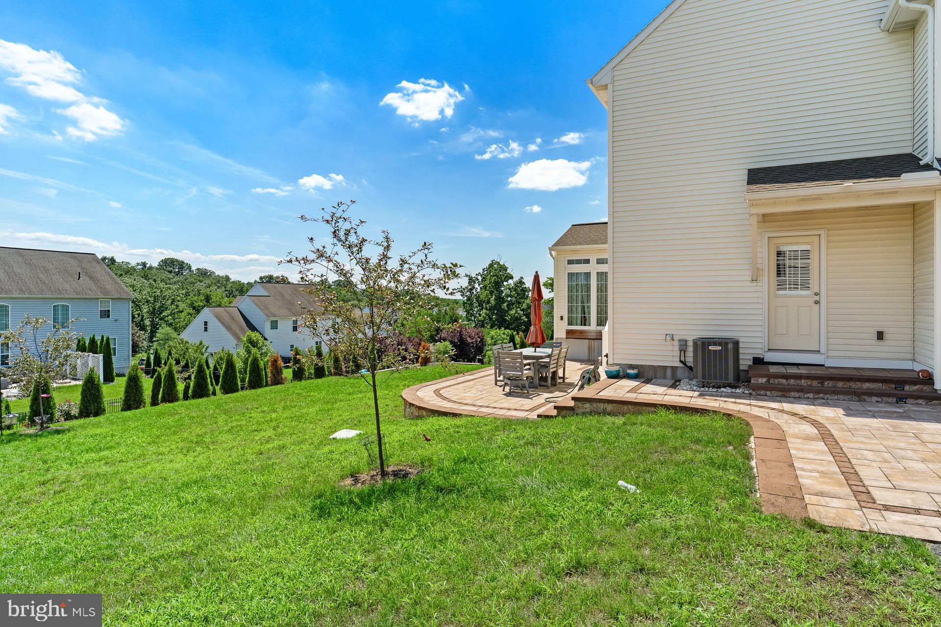 3 Rycroft Road Mechanicsburg, PA 17050 - Photo 37 of 44 Serene backyard with lush greenery.