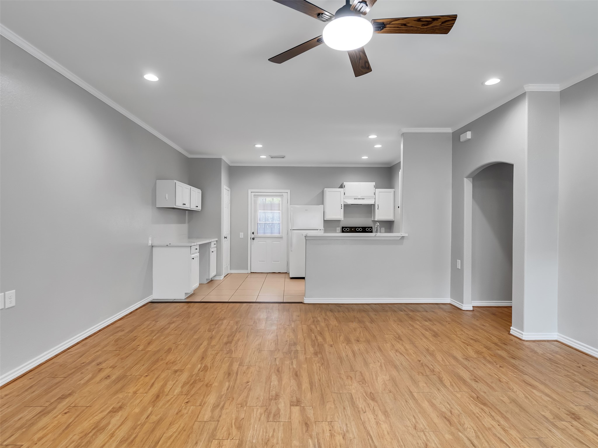 104 Longstreet Road, Unit 2 Willis, TX 77378 - Photo 5 of 26 a view of kitchen with cabinets and wooden floor