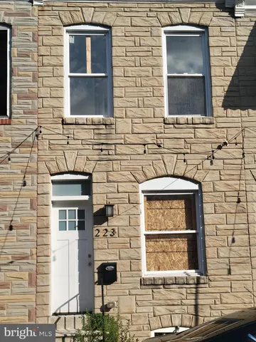 a bathroom with a sink and a window