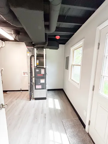 a view of an empty room with a window