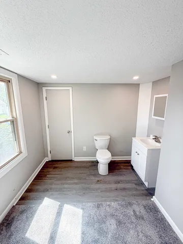 a very nice looking room with a chair and a table