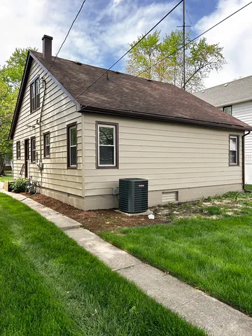 a backyard of a house with seating space