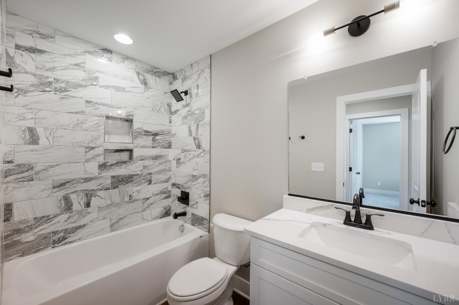 61 Luke Court Rustburg, VA 24588 - Photo 28 of 39 a bathroom with a sink a toilet and a bathtub