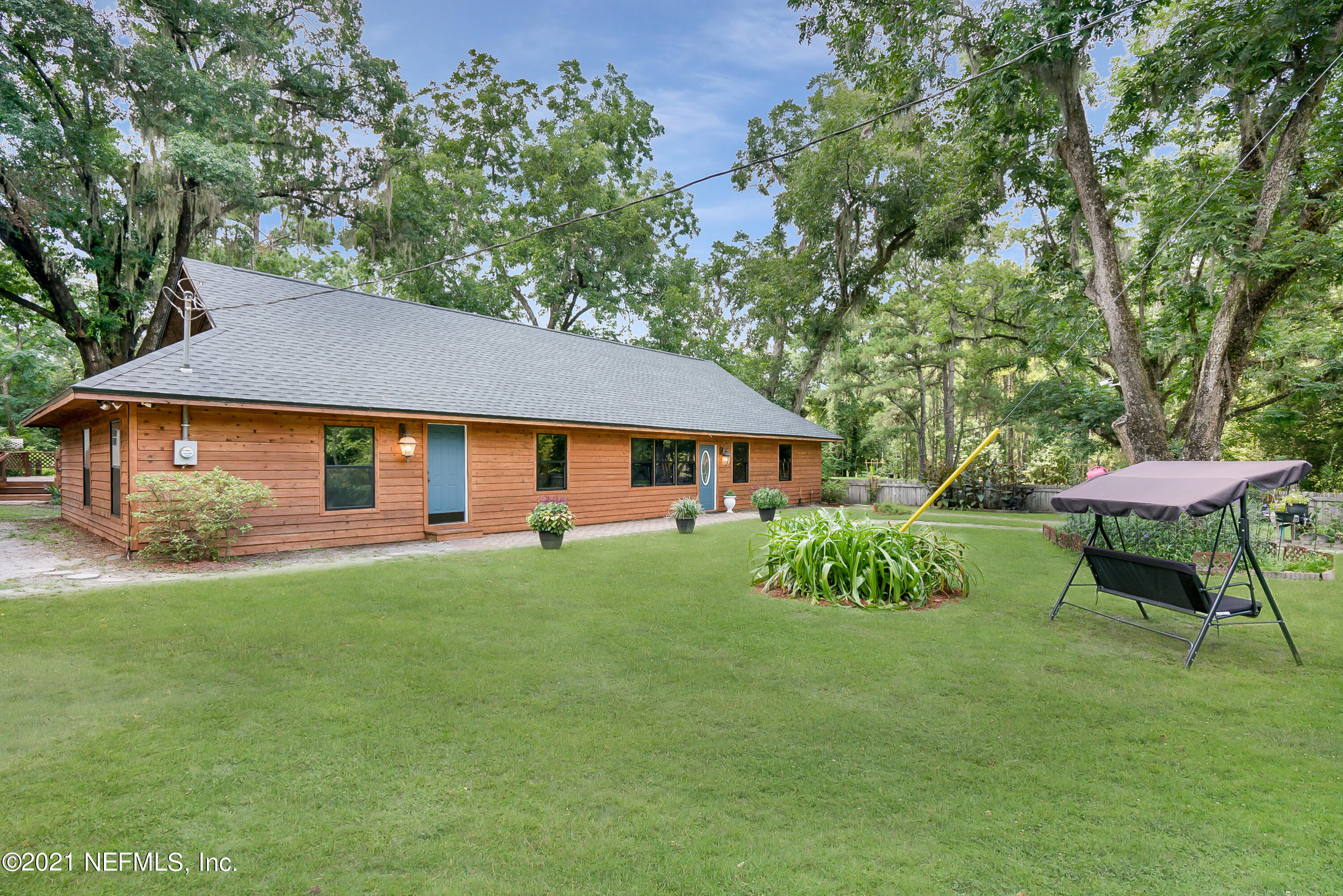444 George Mosley Road Jacksonville, FL 32234 - Photo 48 of 58 a aerial view of a house with a yard table and chairs