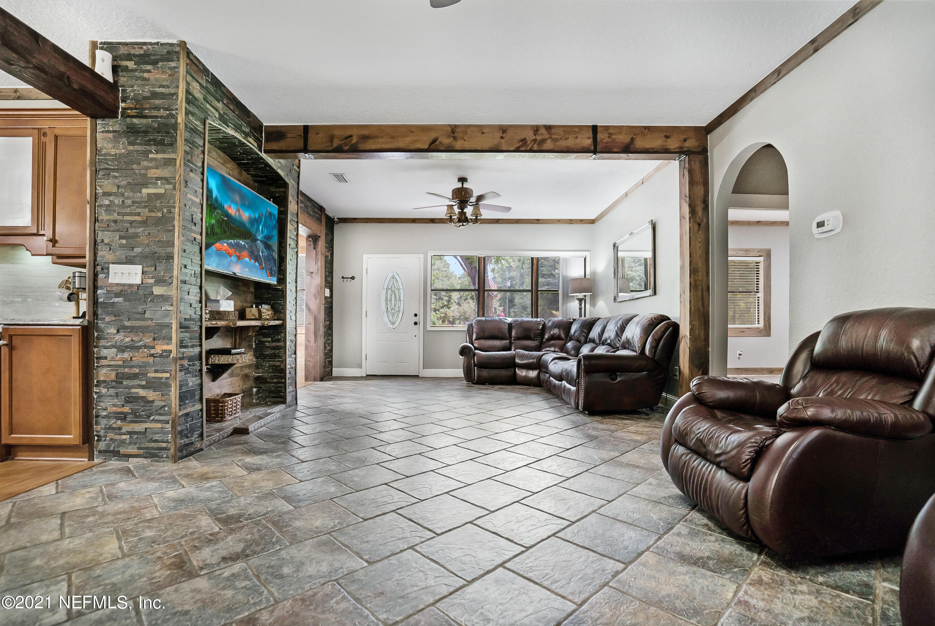 444 George Mosley Road Jacksonville, FL 32234 - Photo 6 of 58 a living room with furniture and a flat screen tv