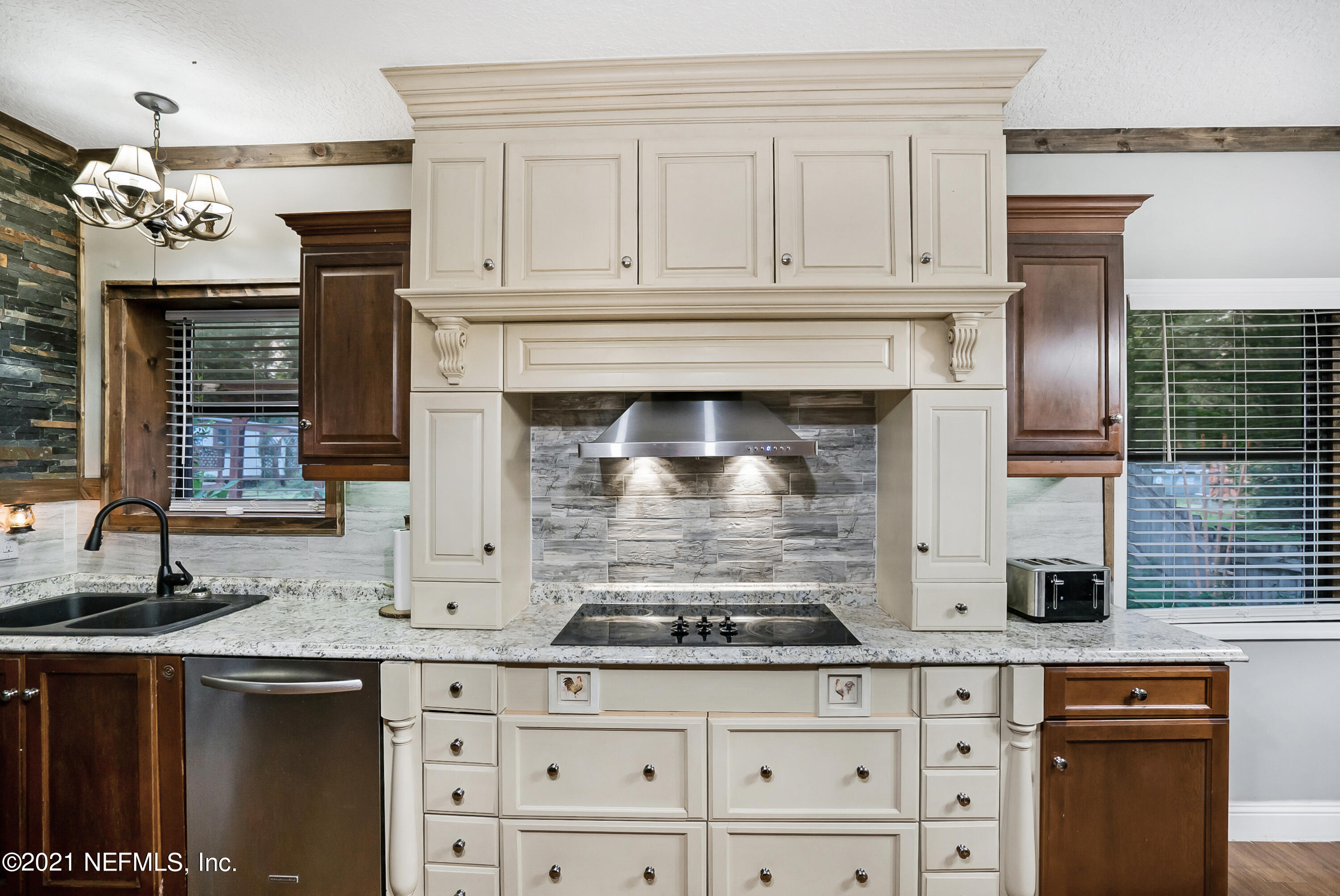 444 George Mosley Road Jacksonville, FL 32234 - Photo 9 of 58 a kitchen with stainless steel appliances granite countertop a stove and a sink