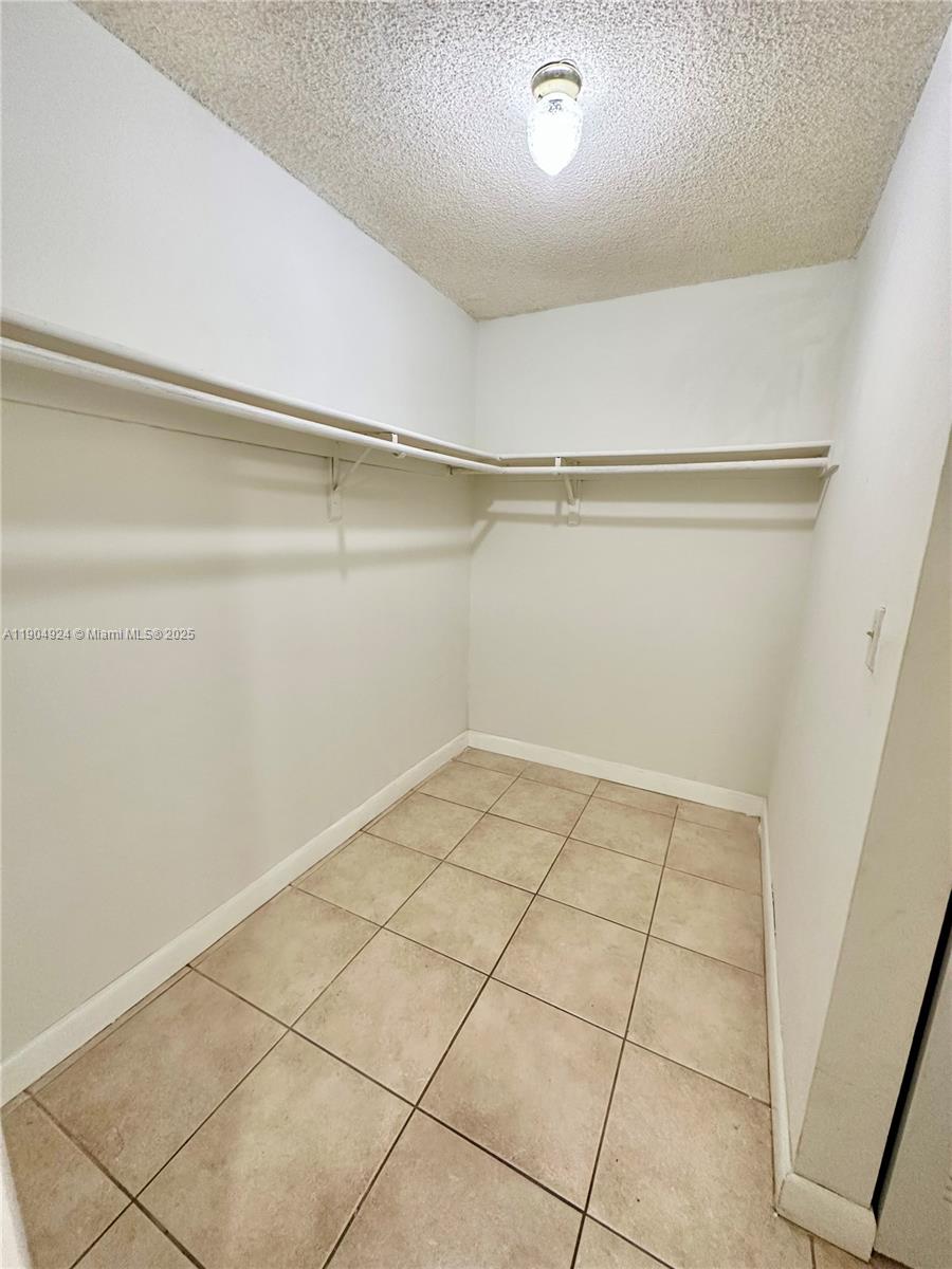 8600 Southwest 109th Avenue, Unit 4211 Miami, FL 33173 - Photo 13 of 25 a view of a room with racks on the wall