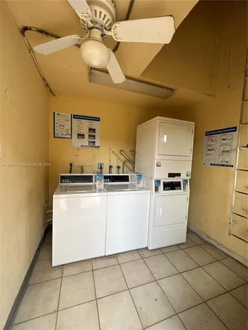 a kitchen with cabinets and white appliances