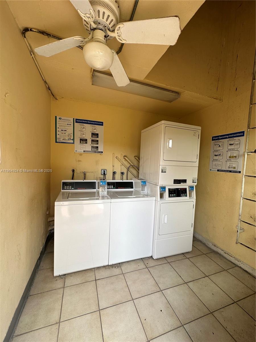 8600 Southwest 109th Avenue, Unit 4211 Miami, FL 33173 - Photo 5 of 25 a kitchen with cabinets and white appliances