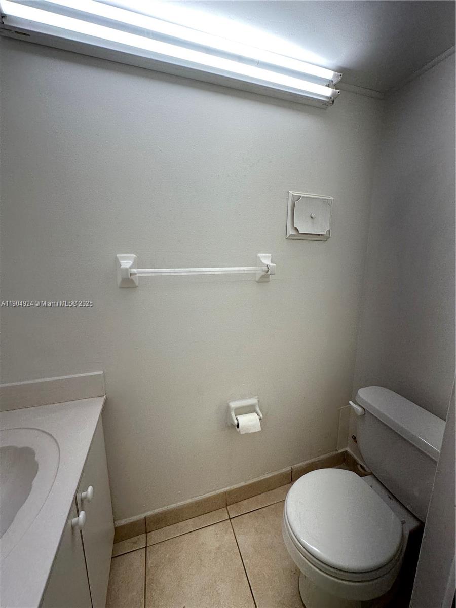 8600 Southwest 109th Avenue, Unit 4211 Miami, FL 33173 - Photo 9 of 25 a white toilet sitting next to a bathroom sink