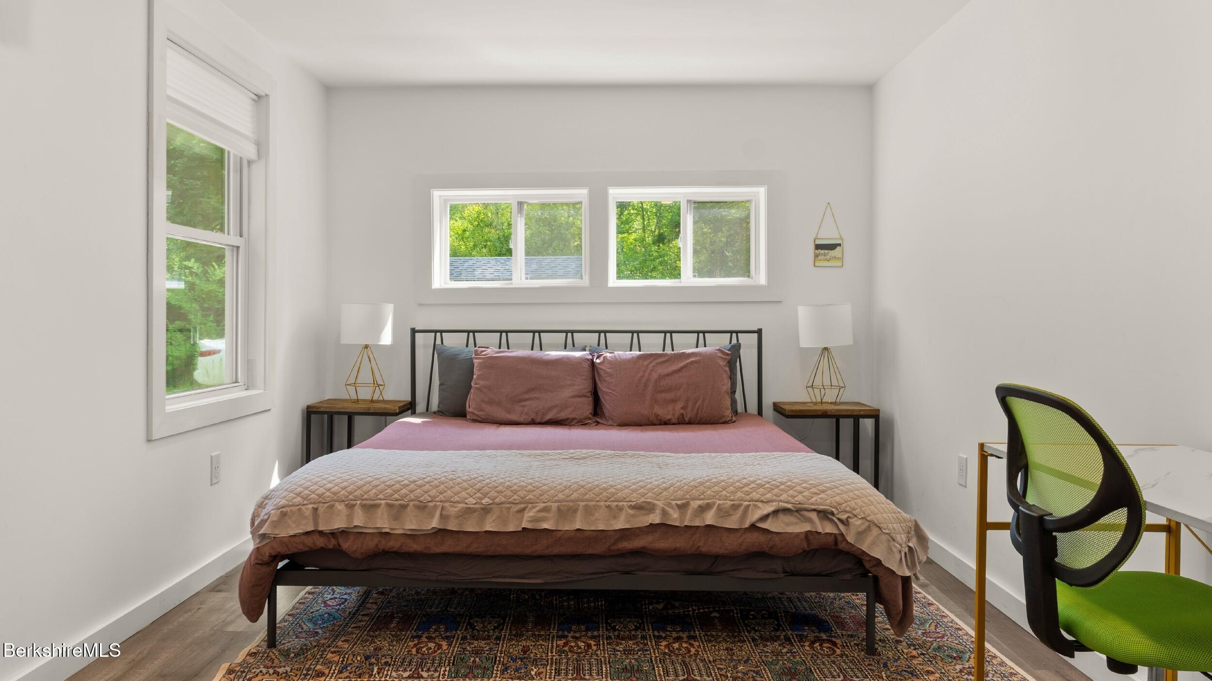 418 Monterey Road Great Barrington, MA 01230 - Photo 12 of 28 a bedroom with a bed a mirror and windows