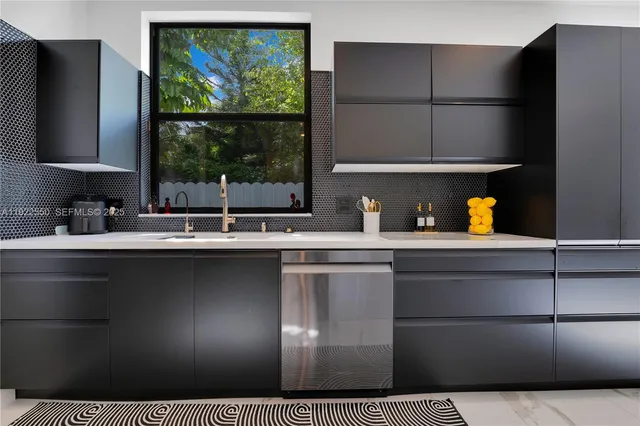 a kitchen with a sink a refrigerator and window