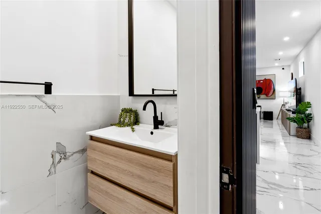 a bathroom with a sink and a mirror