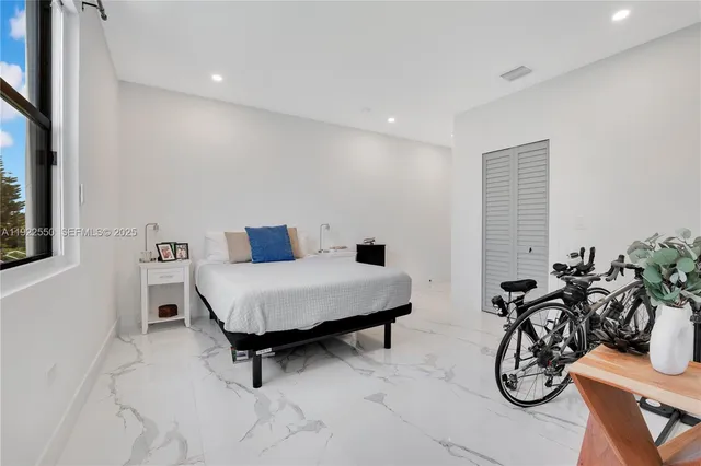 a living room with furniture and white walls