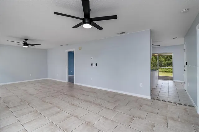 an empty room with fan