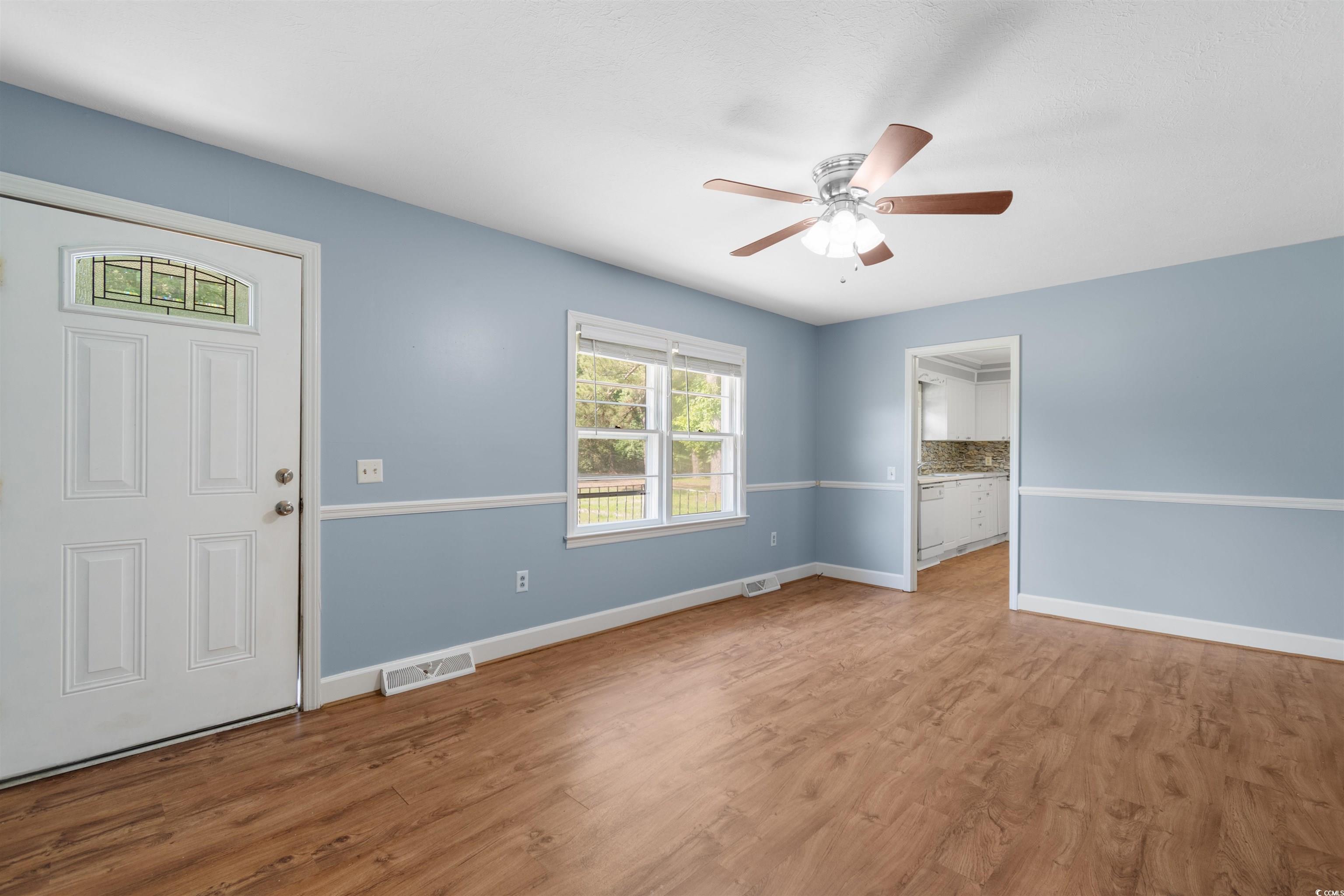 5 County Rd S-45-516 Hemingway, SC 29554 - Photo 3 of 30 Entryway featuring a ceiling fan and wood finished floors