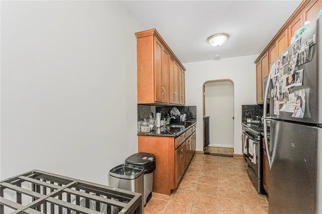 a view of a kitchen with a refrigerator