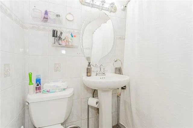 a bathroom with a sink a mirror and a bathtub