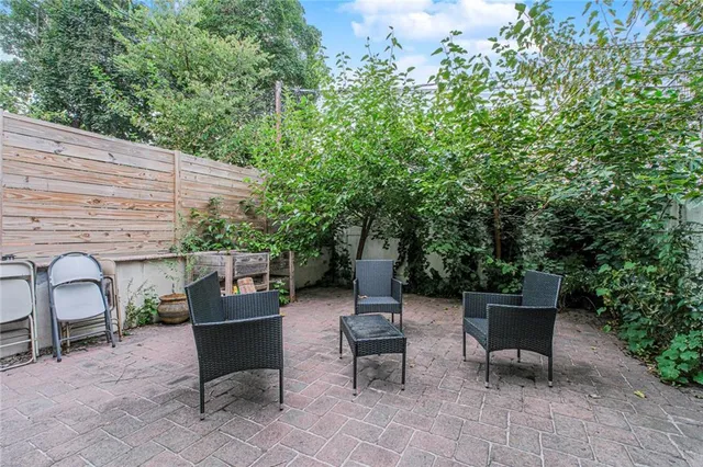 a backyard of a house with outdoor seating