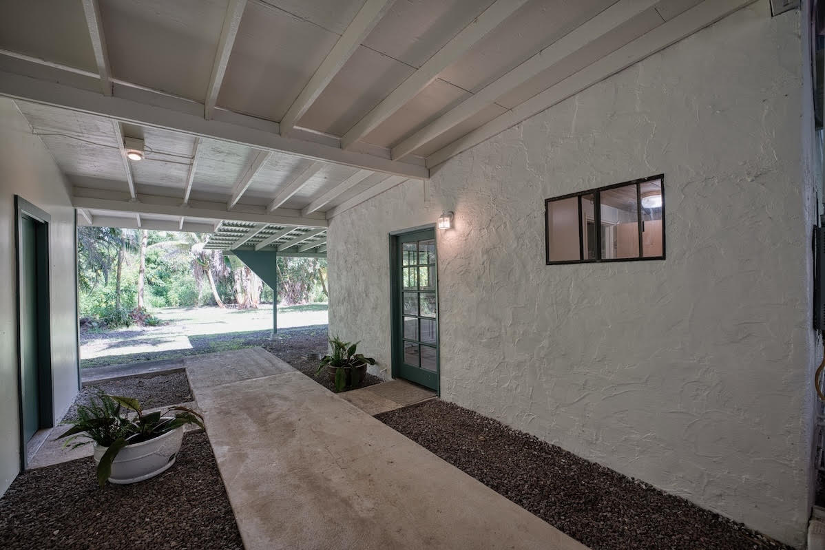17-406 13 Mile Road Kurtistown, HI 96749 - Photo 13 of 29 a living room with furniture and a large window