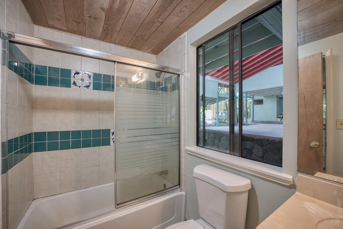 17-406 13 Mile Road Kurtistown, HI 96749 - Photo 20 of 29 a bathroom with a bathtub and a shower