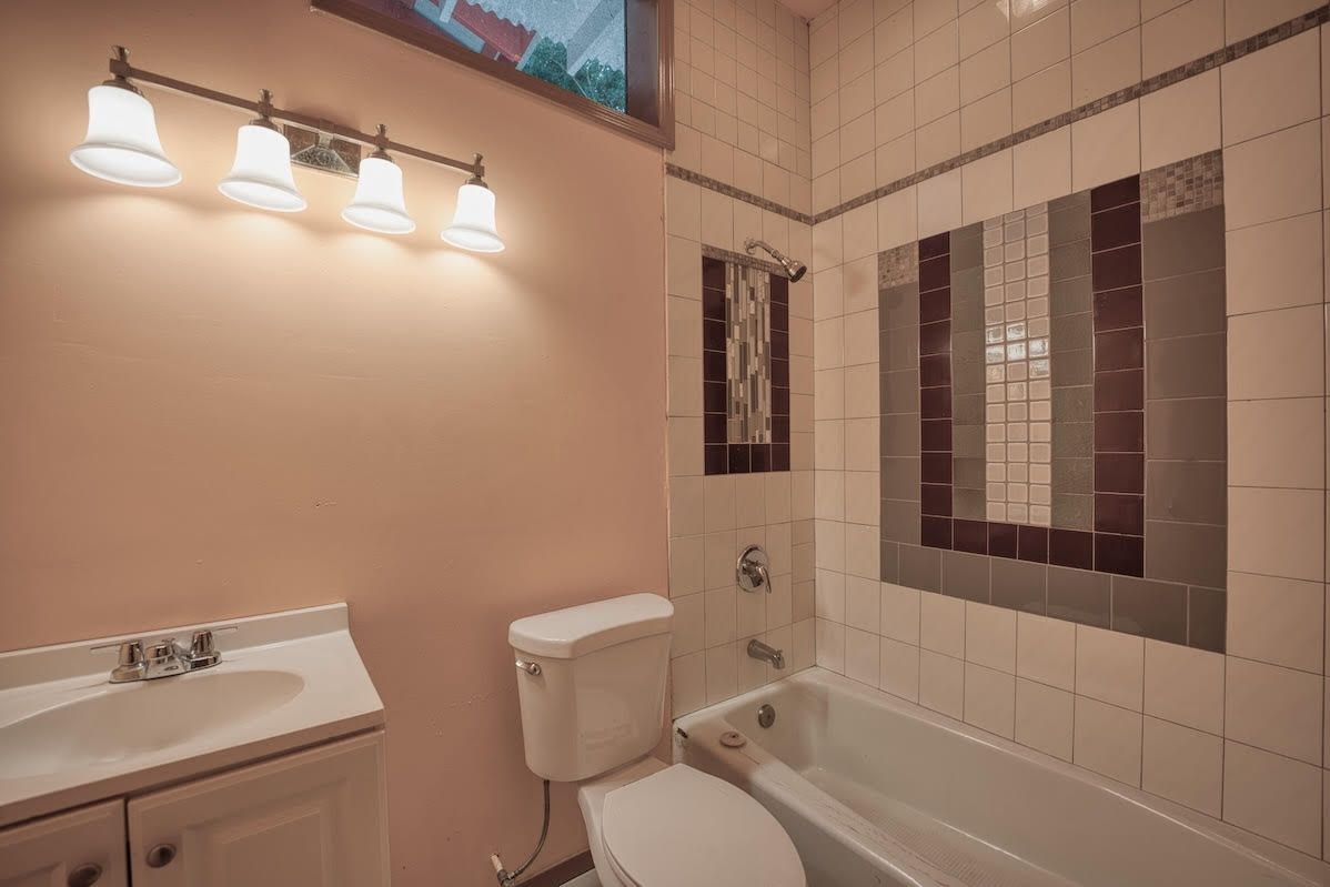 17-406 13 Mile Road Kurtistown, HI 96749 - Photo 22 of 29 a white toilet sitting next to a bathroom sink