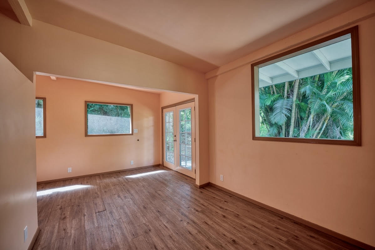 17-406 13 Mile Road Kurtistown, HI 96749 - Photo 23 of 29 a view of an empty room with wooden floor and a window