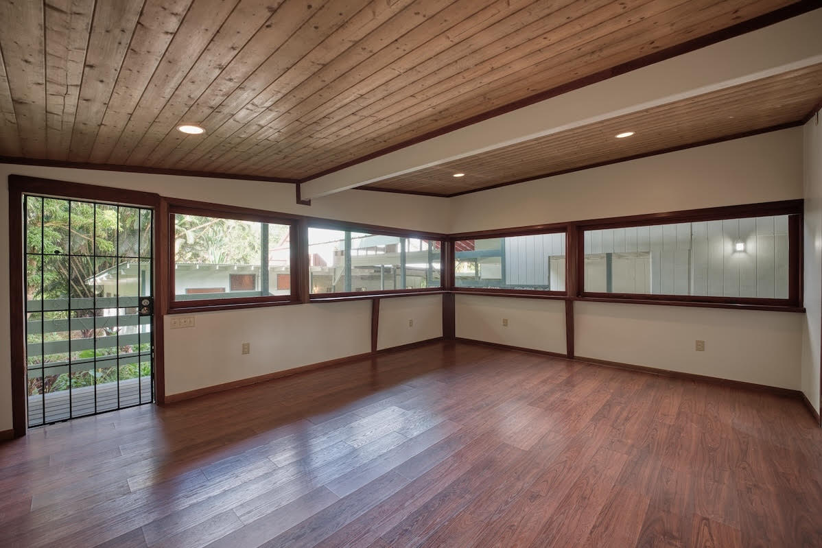 17-406 13 Mile Road Kurtistown, HI 96749 - Photo 24 of 29 a view of an empty room with wooden floor and a window