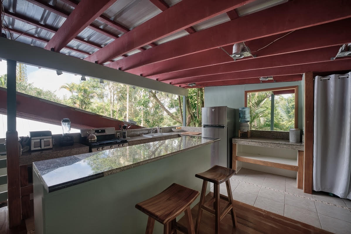 17-406 13 Mile Road Kurtistown, HI 96749 - Photo 28 of 29 a view of a chairs and table in a patio
