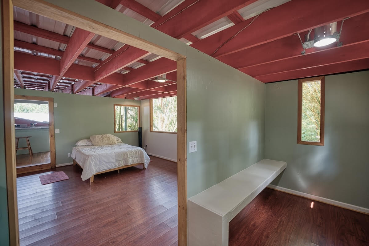 17-406 13 Mile Road Kurtistown, HI 96749 - Photo 29 of 29 a living room with a bed and a window