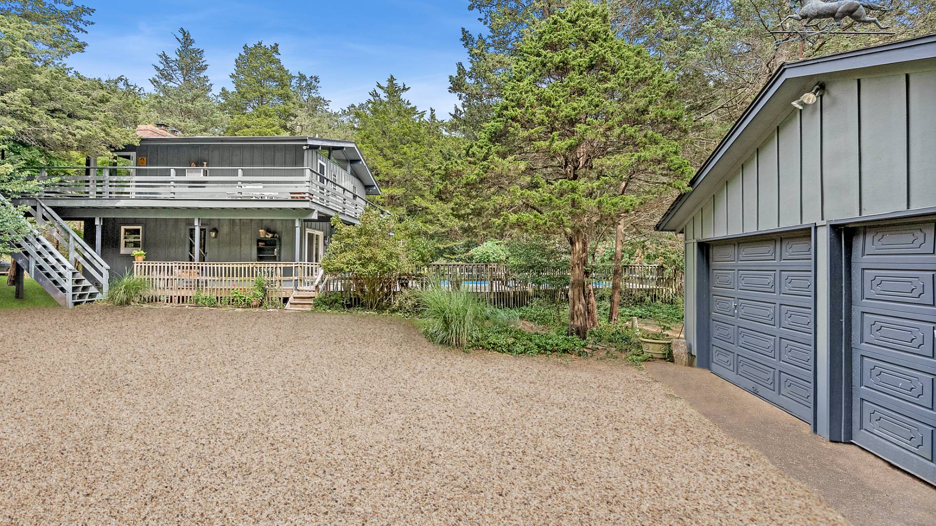 11 Shoridge East Hampton, NY 11937 - Photo 2 of 14 front view of a house with a street