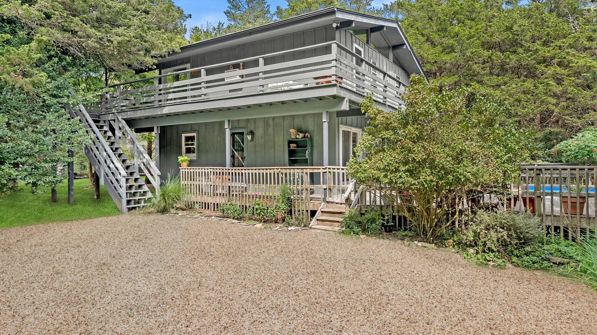 11 Shoridge East Hampton, NY 11937 - Photo 3 of 14 front view of a house with a garden