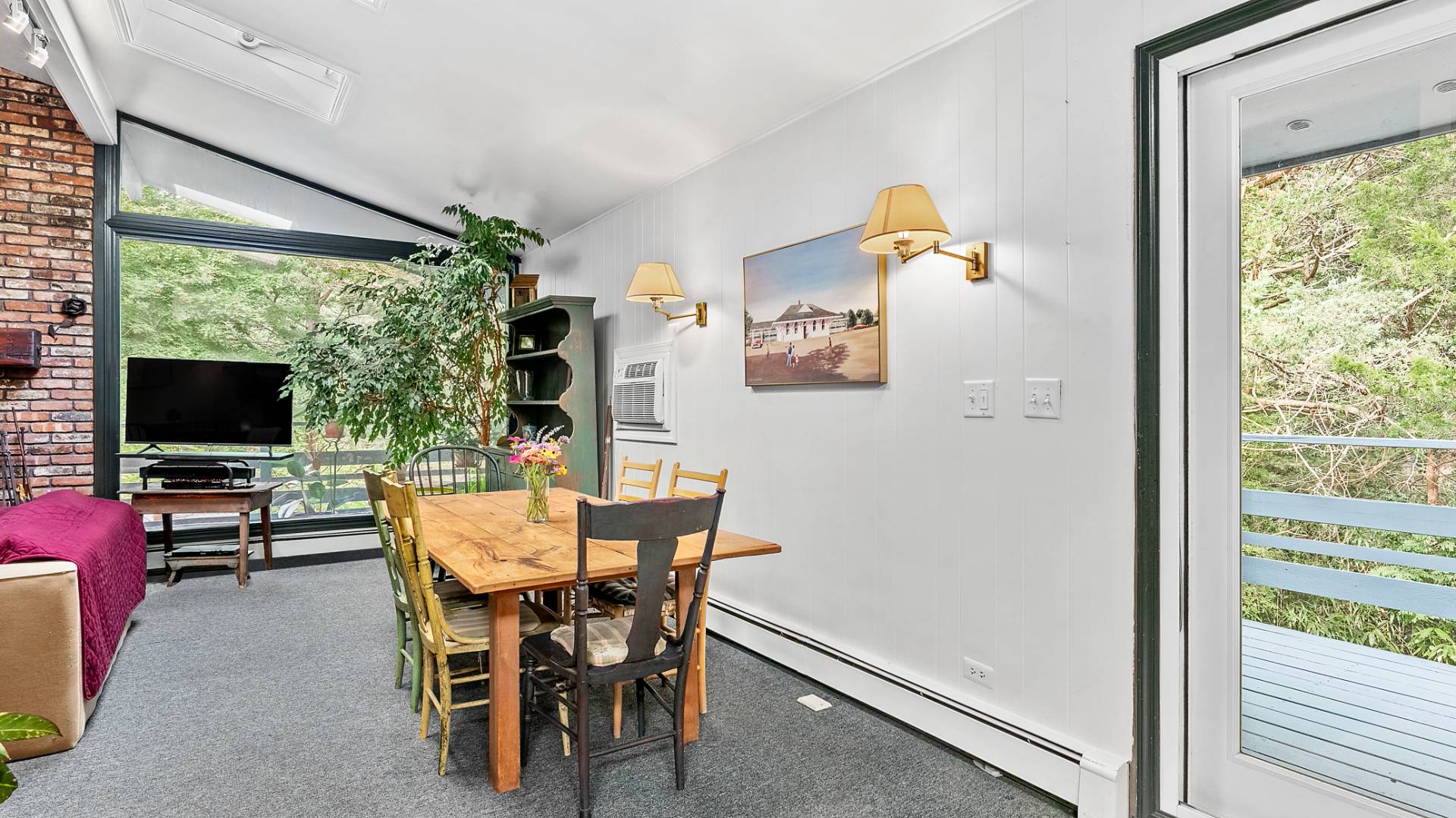 11 Shoridge East Hampton, NY 11937 - Photo 7 of 14 a view of a livingroom with furniture and a flat screen tv