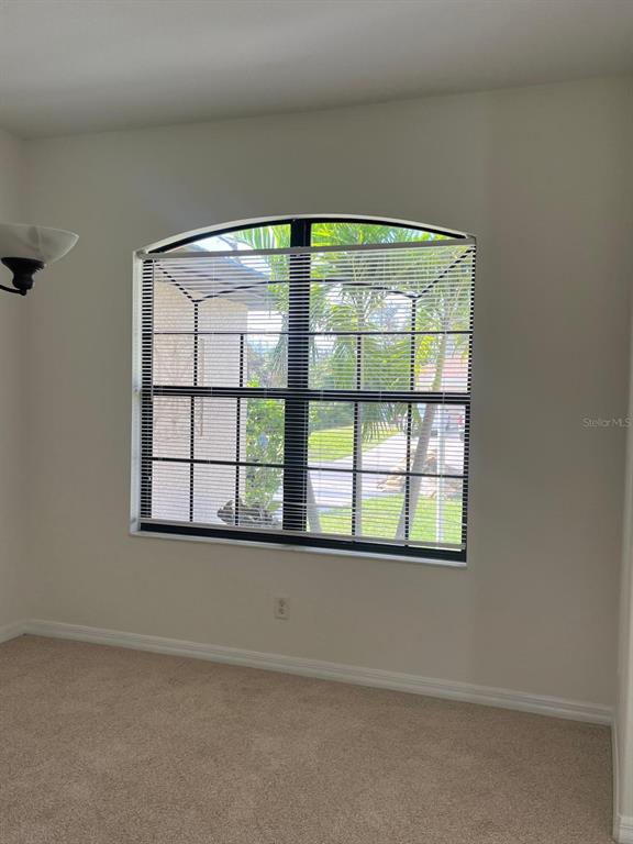 4458 Maverick Street North Port, FL 34288 - Photo 7 of 8 an empty room with a window