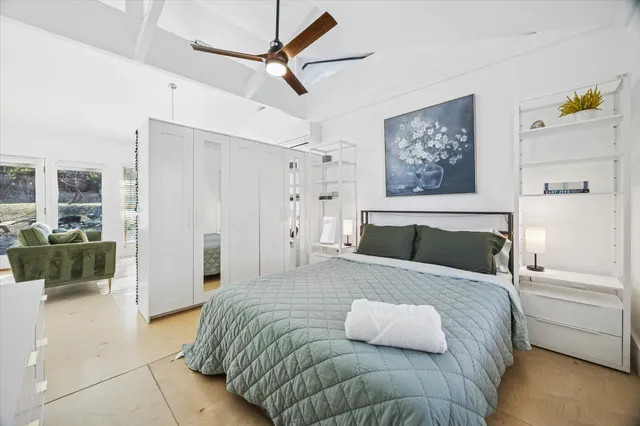 a bedroom with a bed and a walk in closet