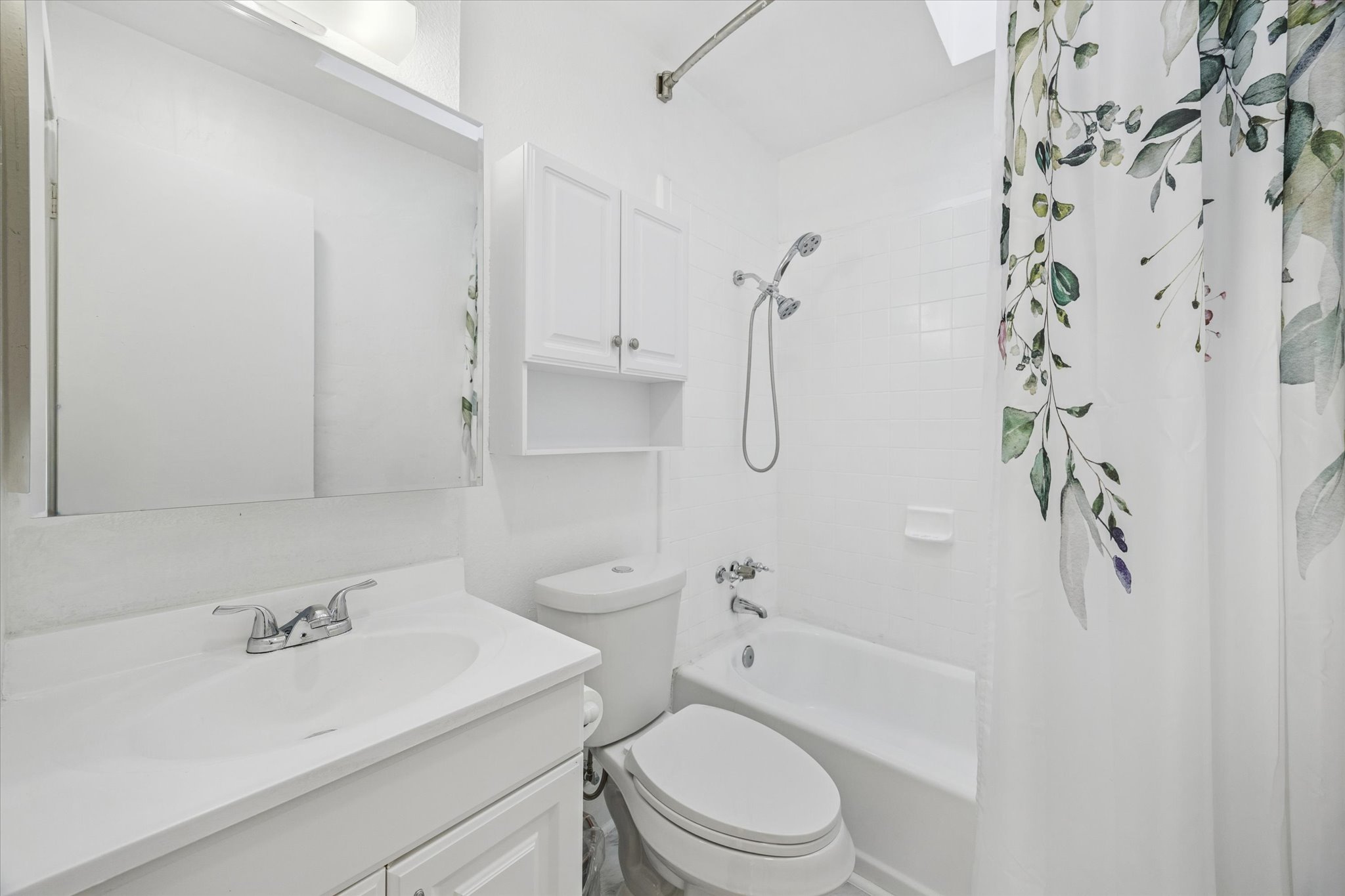 213 Lessin Lane Austin, TX 78704 - Photo 15 of 16 Bathroom featuring shower / tub combo and vanity