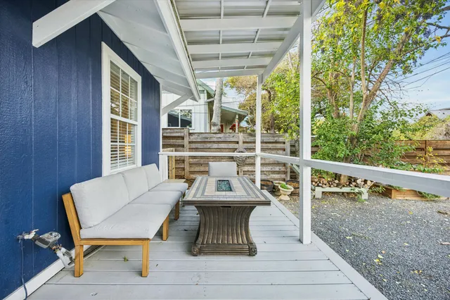 a view of a chairs and table in the balcony