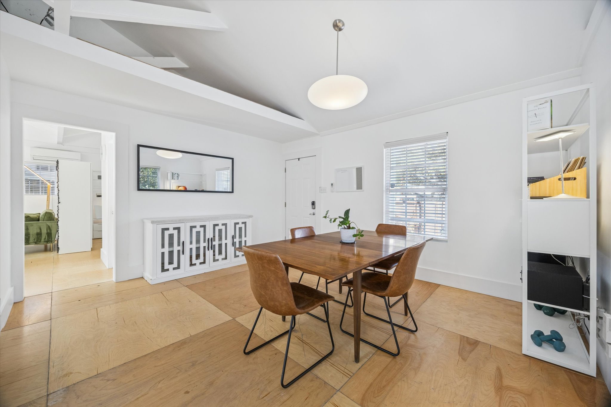 213 Lessin Lane Austin, TX 78704 - Photo 7 of 16 Dining room featuring vaulted ceiling and light wood-type flooring