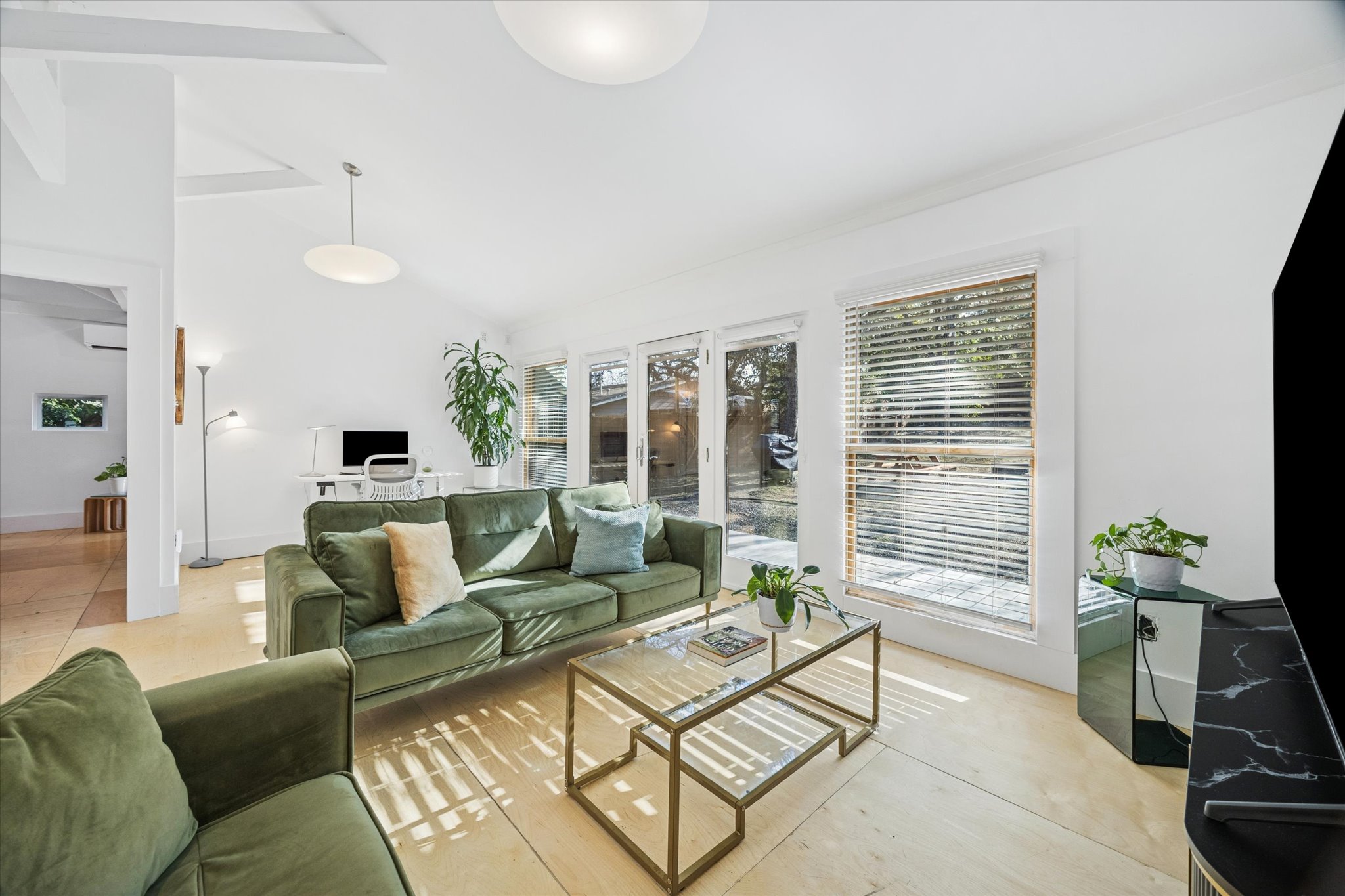 213 Lessin Lane Austin, TX 78704 - Photo 10 of 16 Living room with vaulted ceiling