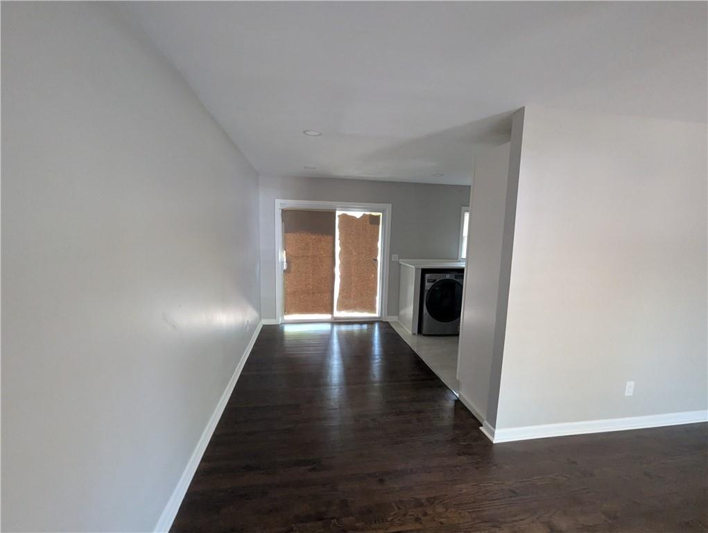 4308 Sheppard Drive Conley, GA 30288 - Photo 3 of 11 a view of a hallway with wooden floor and a fire place