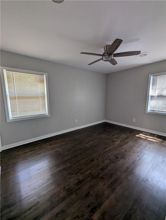 4308 Sheppard Drive Conley, GA 30288 - Photo 9 of 11 a view of an empty room with wooden floor and a window