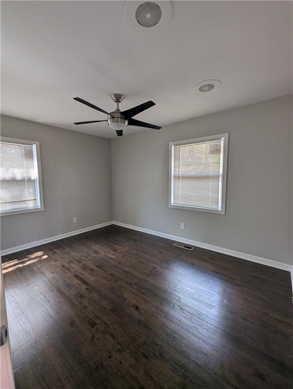 4308 Sheppard Drive Conley, GA 30288 - Photo 10 of 11 a view of an empty room with wooden floor and a window
