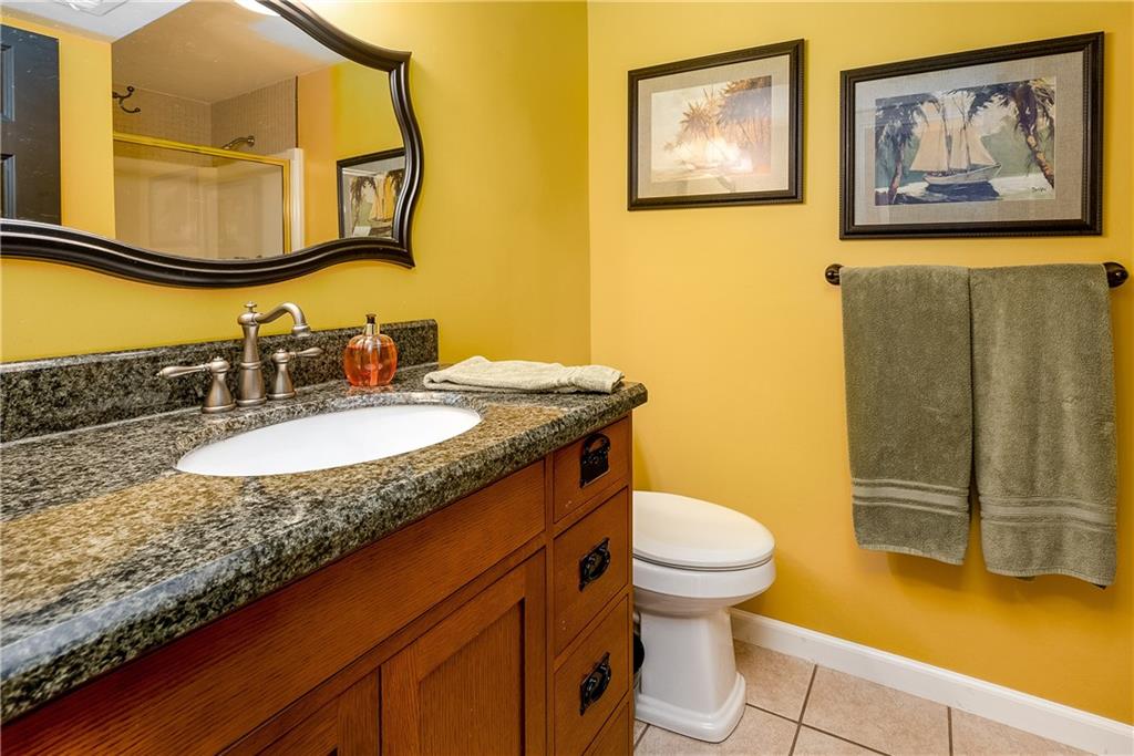 17 Parkcrest Drive Cecil, PA 15321 - Photo 20 of 25 a bathroom with a granite countertop sink and a mirror