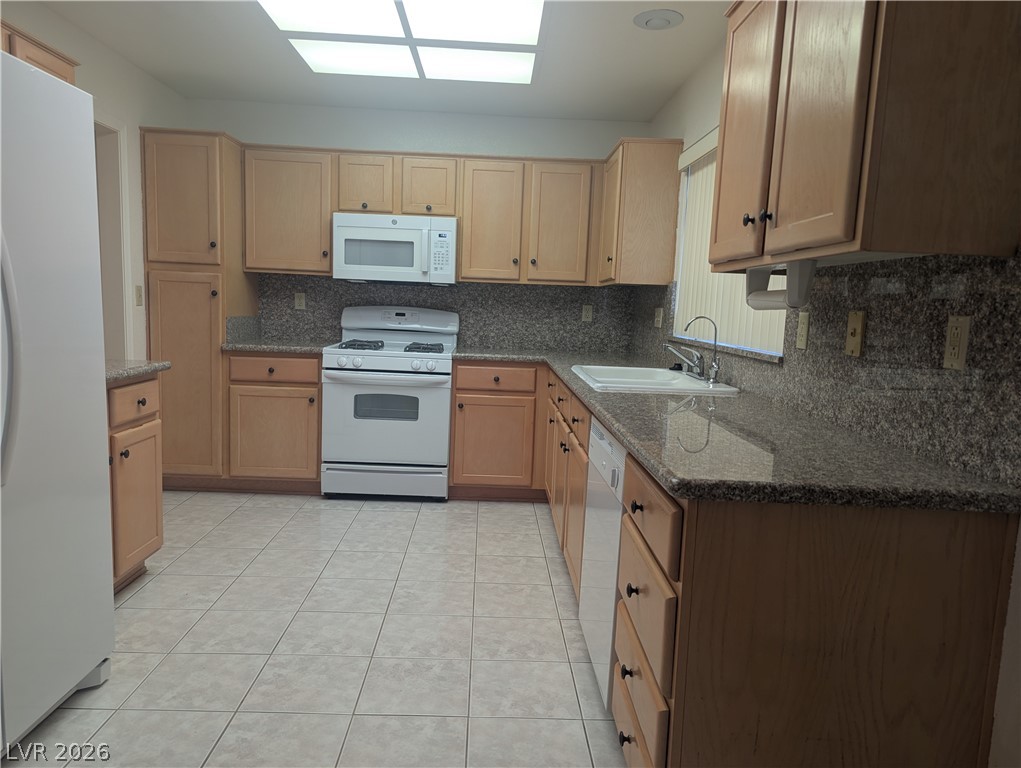 9433 Quail Ridge Drive Las Vegas, NV 89134 - Photo 6 of 23 A functional kitchen space featuring ample cabinetry and a practical layout for daily meal preparation.
