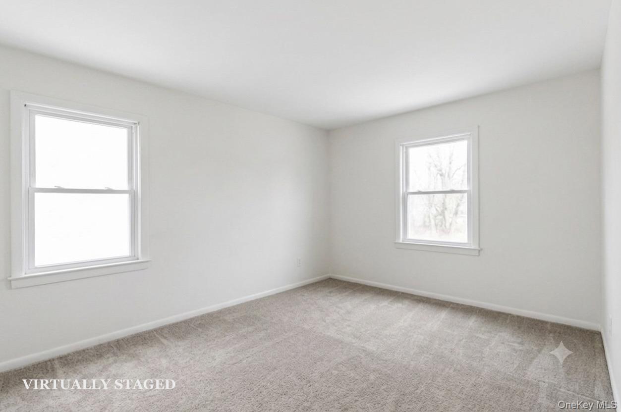 508 New Rochelle Road, Unit 2 Bronxville, NY 10708 - Photo 8 of 18 Bedroom 2 - virtually staged to show empty with new carpeting